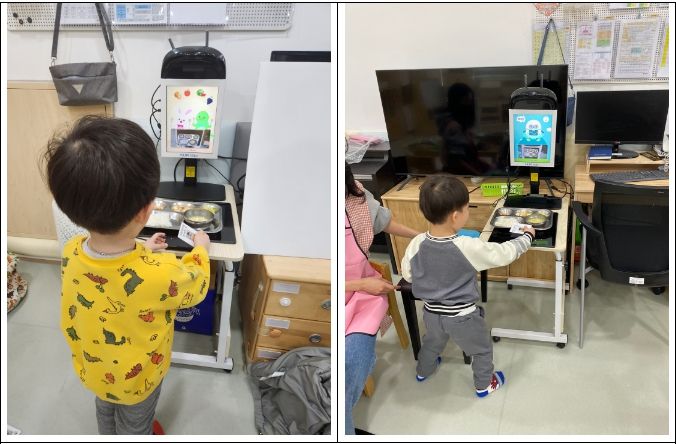 식판을 스캔하는 명륜어린이집 원아 모습